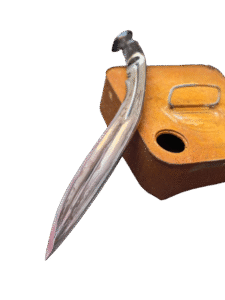 Mutant Angkhola Kukri by Himalayan blades placed on a rusted tin