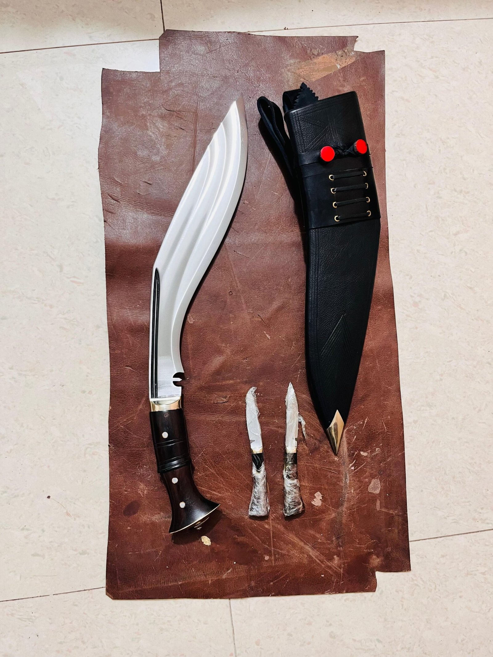 Tin Chira Kukri Knife handforged in Nepal placed on leather sheath